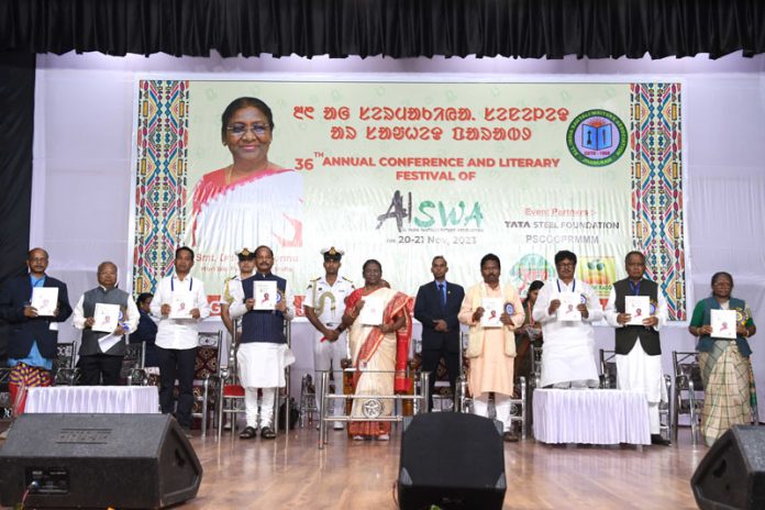 President Droupadi Murmu releasing a publication at the 36th Annual Conference and Literary Festival of All India Santali Writers’ Association at Baripada, Odisha on Monday. (UNI)