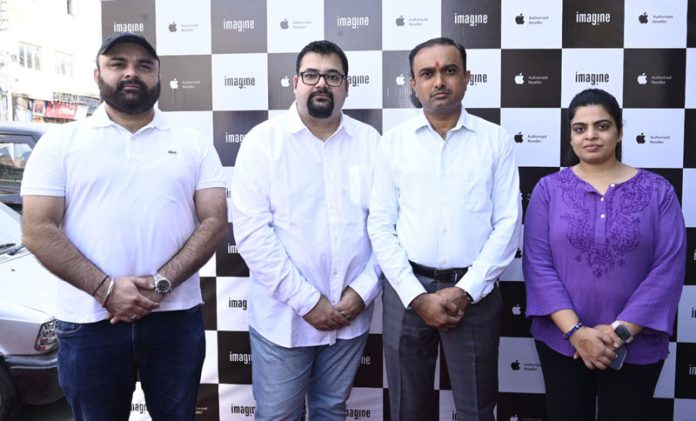 Divisional Commissioner Jammu Ramesh Kumar posing with executives of Tresor Group at their new Experiential Apple store in Jammu.