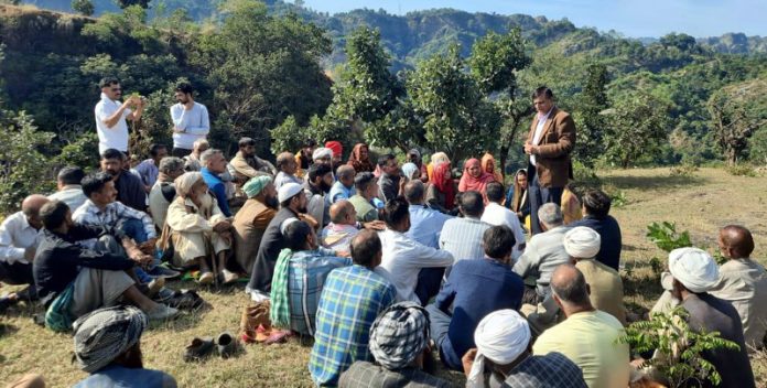 DDC Chairman Col Mohan Singh addressing villagers at Malera village in Kandi area of Kathua.