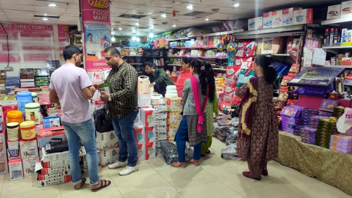 Customers busy in shopping at Vishal Mart on Thursday.