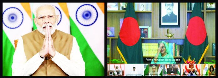 Prime Minister Narendra Modi with his Bangladesh counterpart Sheikh Hasina jointly inaugurate Akhaura (Bangladesh) -Agartala Rail link, Khulna- Mongla Port Rail Line and Unit 2 of Maitree Super Thermal Power Pland in Rampal in Bangladesh virtually, in New Delhi on Wednesday. (UNI)