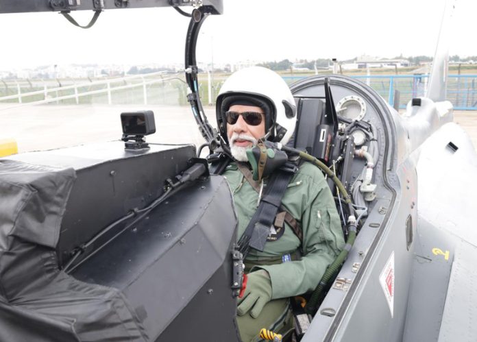 Prime Minister Narendra Modi takes flight in Tejas fighter jet in Bengaluru, during his visit to state-run Hindustan Aeronautics Limited on Saturday. (UNI)