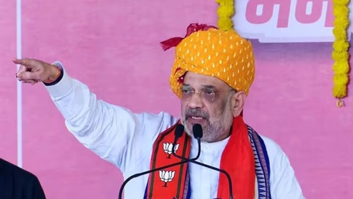 Union Home Minister Amit Shah addresses a public rally in Madhya Pradesh’s Dhar district on Saturday.