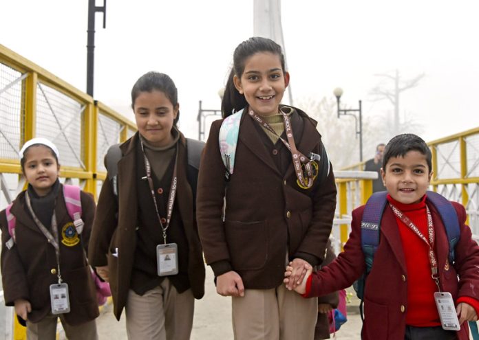 Joyful students head home after announcement of winter vacation in Srinagar on Saturday.