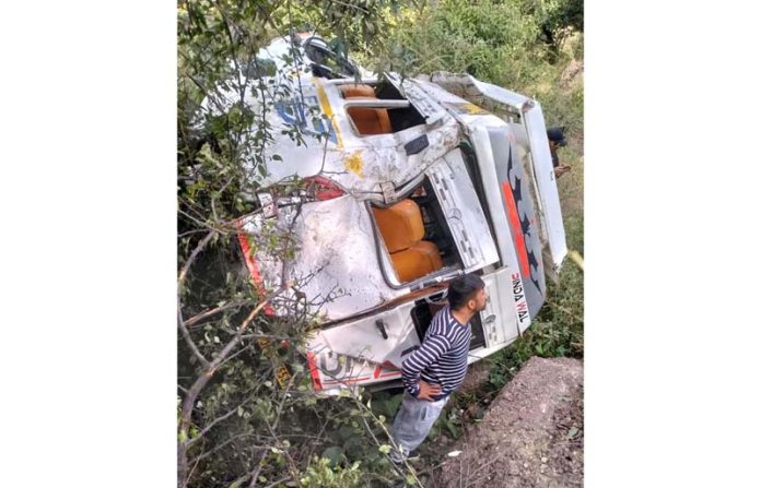A Tempo Traveller which fell into gorge in Rajouri on Monday.