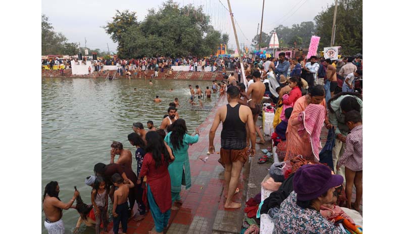 Thousands of devotees taking holy dip at Jhiri Sarovar on Monday.-Excelsior/Rakesh