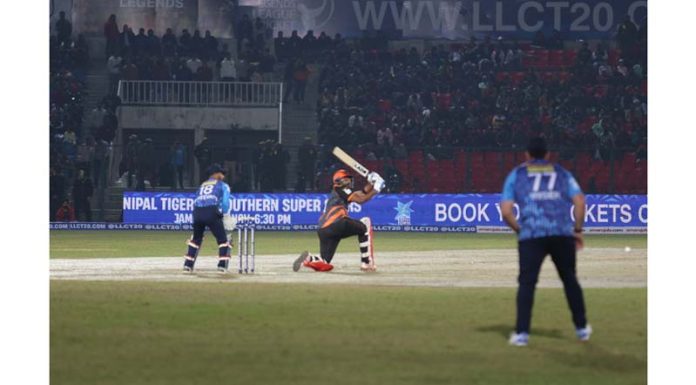 A batsman hitting a shot during a Legends League Cricket match in Jammu on Monday. -Excelsior/Rakesh