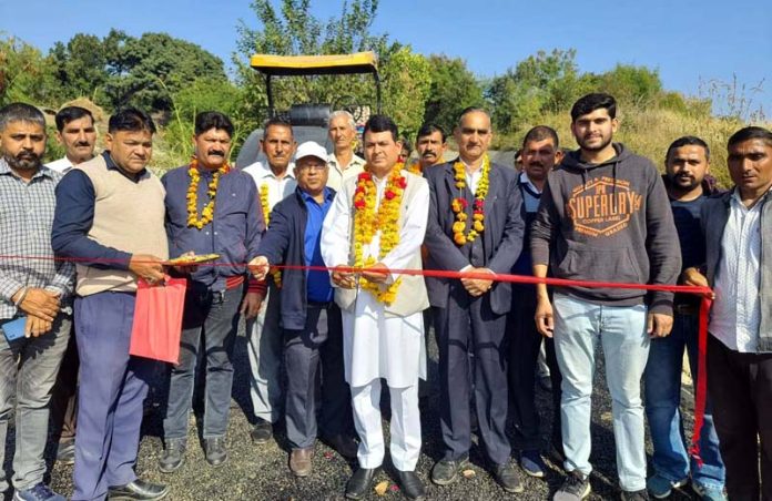 BJP leader, Pt. Suresh Sharma starts blacktopping work of Chowki Choura to Salodi road near Akhnoor on Thursday.