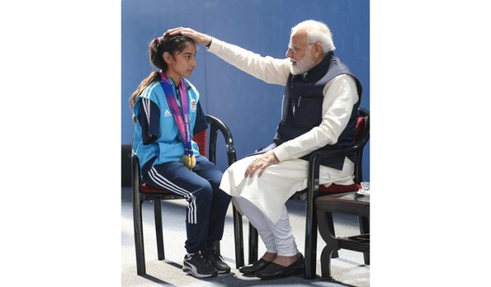 Prime Minister Narendra Modi giving blessings to Jammu and Kashmir Para Archer Sheetal Devi.