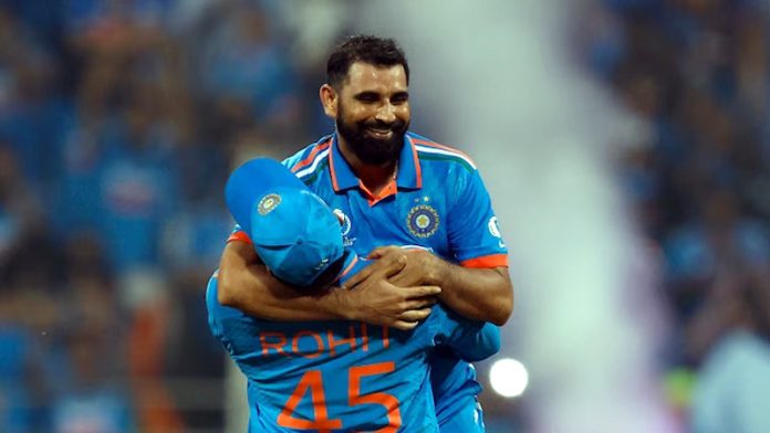 Skipper Rohit Sharma lifts Mohd Shami up in jublilation after he took seven wickets in a match.