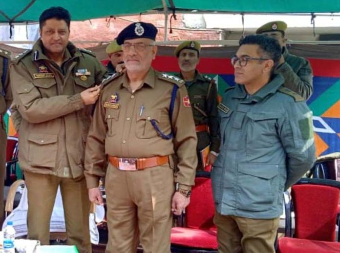 Commanding Officer of IRP 11th Battalion, Sandeep Mehta, pinning rank on a newly promoted DySP in Anantnag on Thursday.