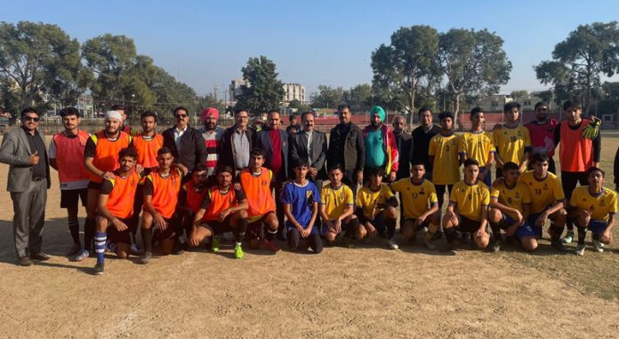 Football teams posing for group photograph at Jammu on Tuesday.