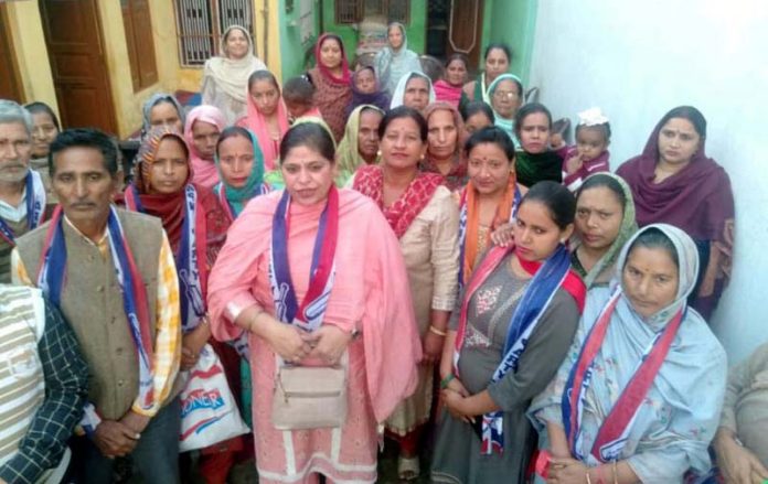 AP Provincial president Jammu Women Wing, Pavneet Kour with locals in Hakkal area of Satwari on Thursday.