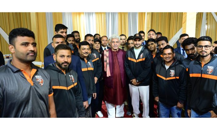 Lieutenant Governor, Manoj Sinha posing with Legends League Cricket players at Raj Bhawan Jammu on Tuesday.