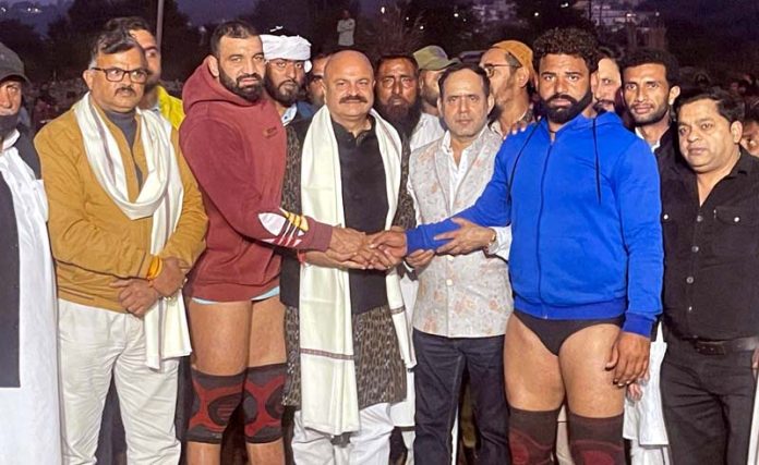Yudhvir Sethi, J&K BJP vice president introducing wrestlers before a bout during a Dangal event on Saturday.