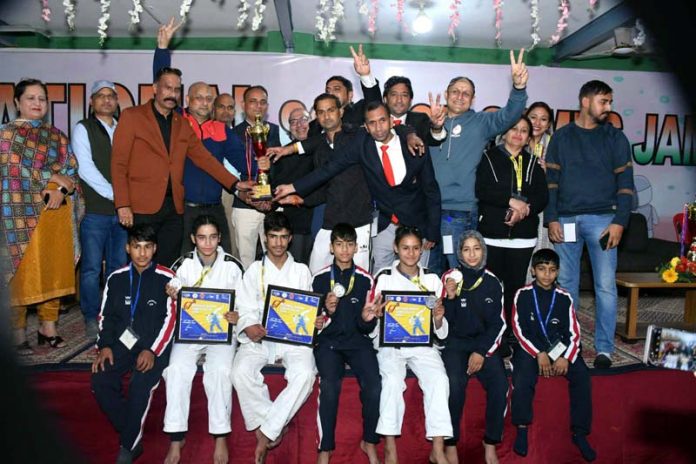 Jammu and Kashmir Judo team posing with runners-up trophy on Saturday. 