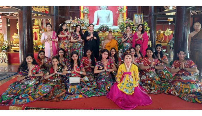 Students of Heritage School in colourful costumes posing during an Int'l Dance competition at Thailand.