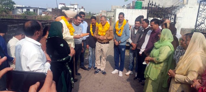 Senior BJP leader and former Dy CM, Kavinder Gupta kick starting work of lanes and drains in Belicharana on Thursday.