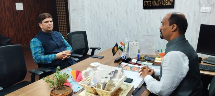 Puneet Mahajan BJP Health and Medical Cell, convener during a meeting with CEO Ayushman Bharat Sanjiv M Gadkar at Jammu on Friday.