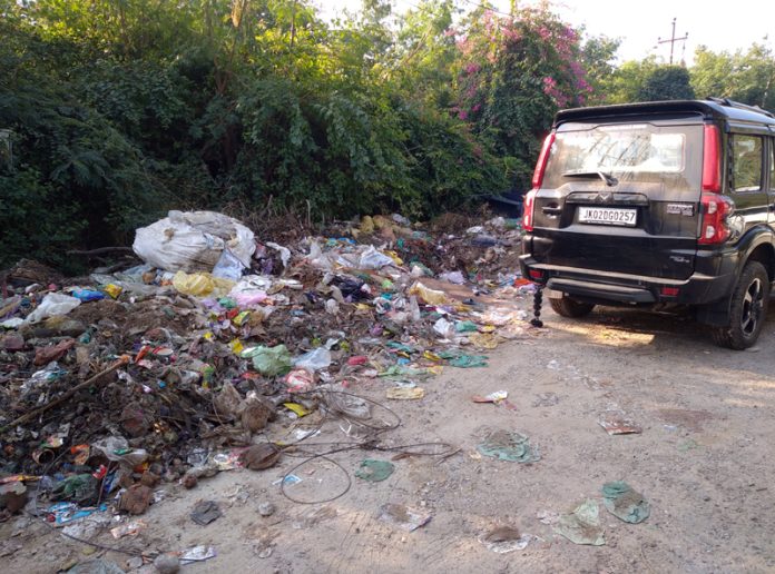 A garbage dump near Manda walking track gate in Jammu on Thursday.