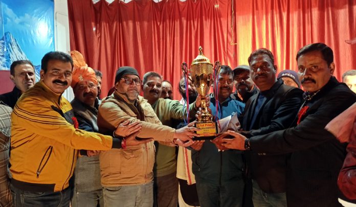 Members of the winner Ramlila Club pose for a group photograph after completion of Ramlila competition in Udhampur.