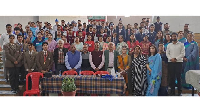 Students posing with guests and other dignitaries during INTACH Quiz at Jodhamal Public School, Jammu.