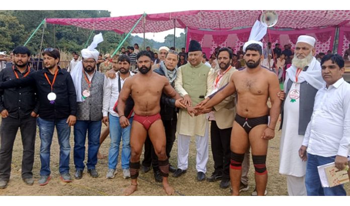 MP Gulam Ali Khatana posing with wrestlers during Dangal at Sydney Ground, Bathindi.