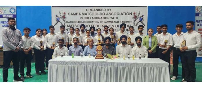 Players of Matsogi-Do posing with dignitaries during 3rd District Samba Matsogi-Do Championship.