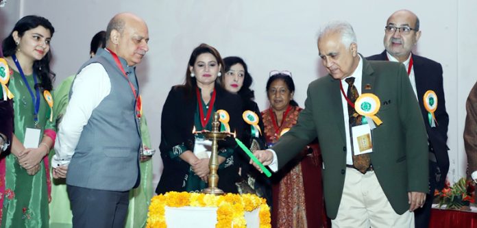 Dr Shakti Gupta lighting ceremonial lamp at inaugural of CME by J&K ASI at Jammu on Saturday.