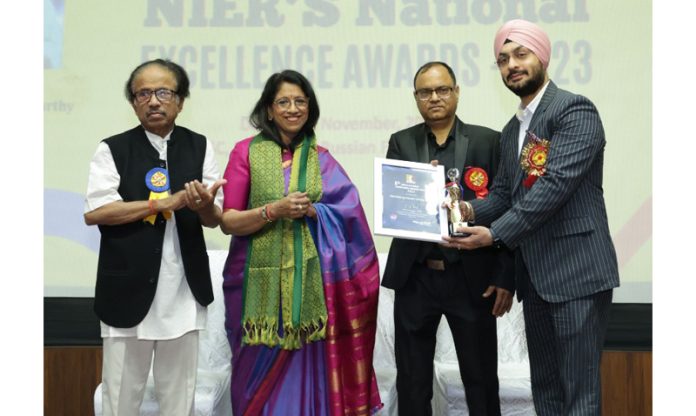 C S Paul, Delhi Bureau Chief of Daily Excelsior (J&K), receiving award from dignitaries at NIER'S National Excellence Awards-2023 in New Delhi.