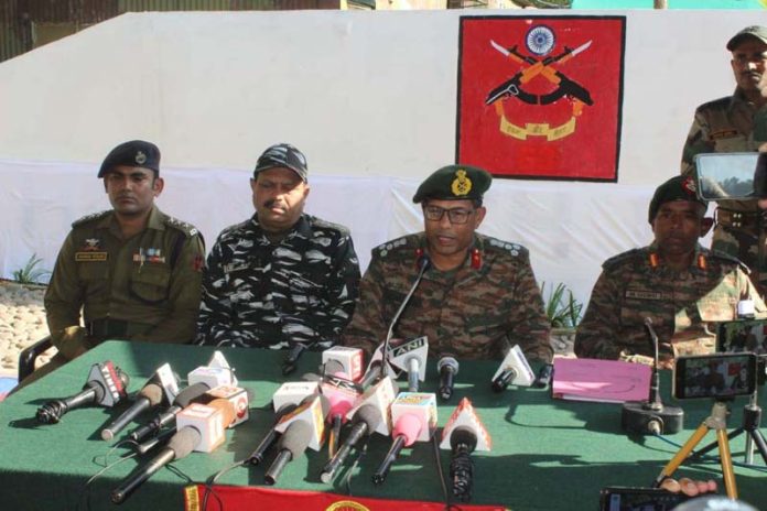 Army and police officers addressing a press conference in Kalakote on Friday. -Excelsior/Imran