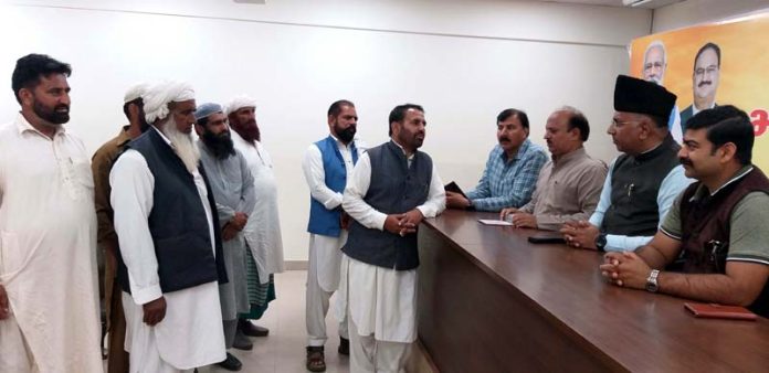 MP Gulam Ali Khatana and BJP general secretary Dr Devinder Kumar Manyal listening public grievances at Jammu on Wednesday.