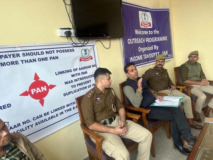 Officer from Income Tax Department during an outreach programme with cops.