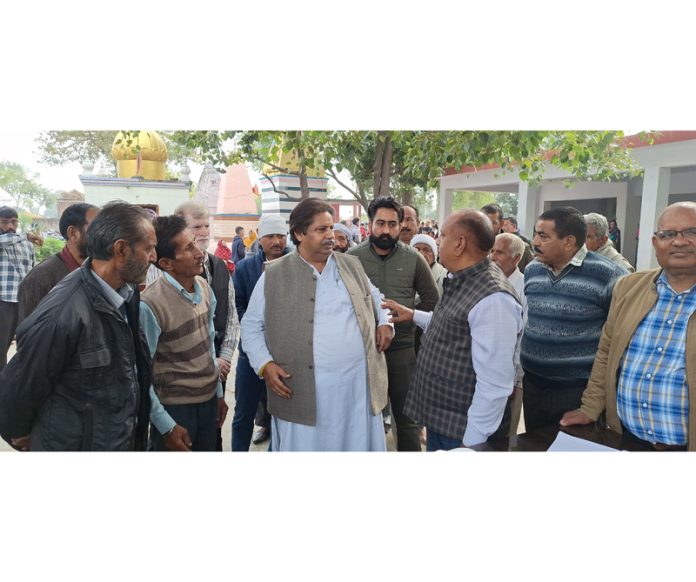 JKPCC working president, Raman Bhalla interacting with people in RS Pura on Wednesday.
