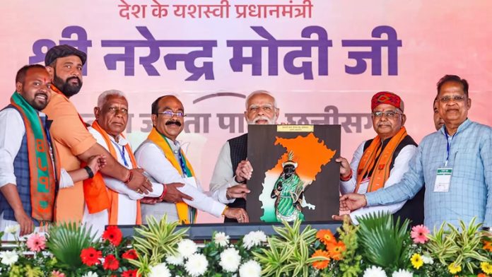 Prime Minister Narendra Modi speaks during a public meeting ahead of the Chhattisgarh Assembly elections, in Mungeli district.