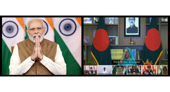 Prime Minister Narendra Modi with his Bangladesh counterpart Sheikh Hasina jointly inaugurate Akhaura (Bangladesh) -Agartala Rail link, Khulna- Mongla Port Rail Line and Unit 2 of Maitree Super Thermal Power Plant in Rampal in Bangladesh virtually in New Delhi on Wednesday. (UNI)
