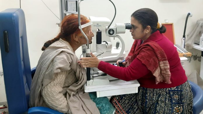 A patient being examined by a health expert during a medical camp in Jammu on Saturday.