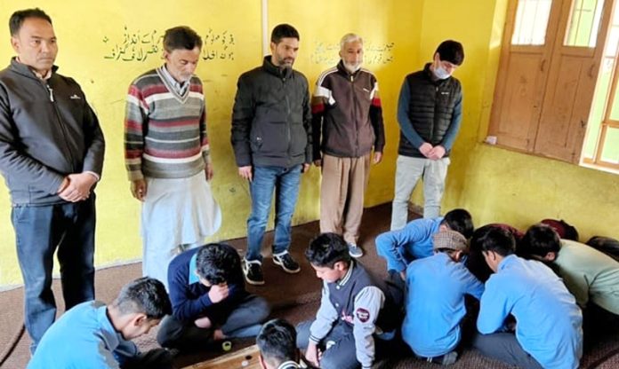 Officers during visit to school in Bandipora.