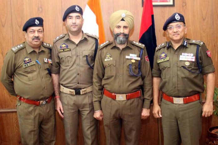 Newly promoted DySP Narinder Singh with IGP Jammu and other police officers at ZPHQ Jammu on Monday.