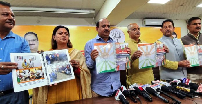 BJP leaders releasing Dy Mayor Baldev Singh Billawaria’s book at Jammu on Thursday.