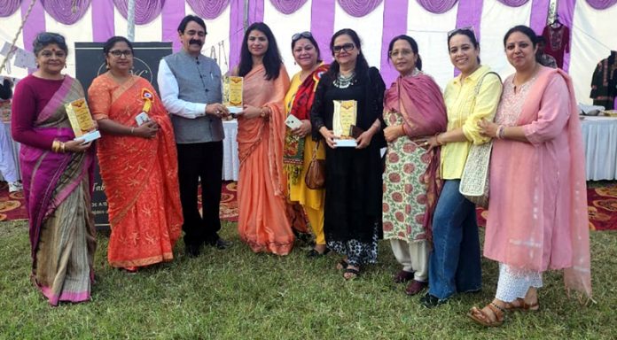 Members of Alumni Association of PSPS College for Women Gandhi Nagar along with College staff and others posing for a photograph during Diwali Mela.