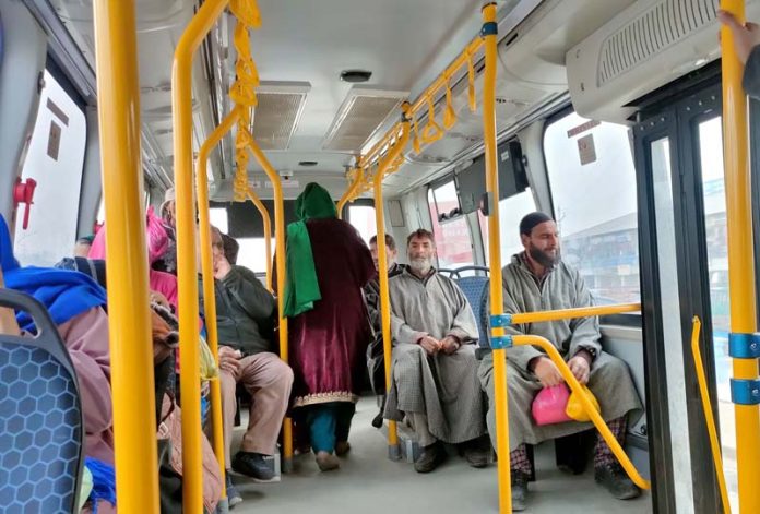 Passengers enjoying their journey on a Smart Bus that operates on various Srinagar routes. -Excelsior/Shakeel