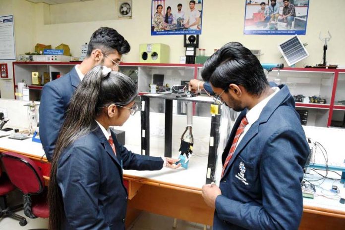 CGC students along with prototype of Smart Borewell Rescue Operation Device invented by them.