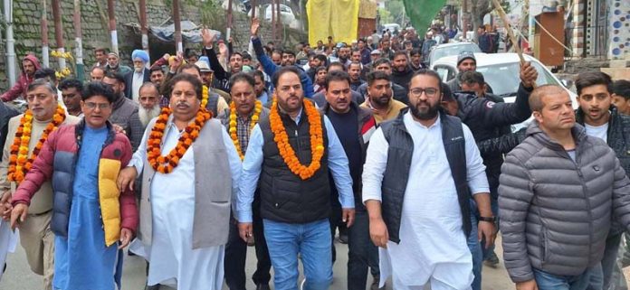 Cong leaders and workers taking out foot match in Ramban.