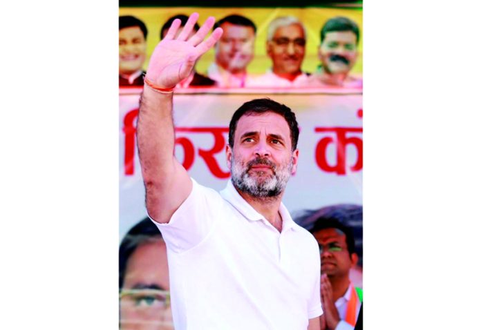 Congress leader Rahul Gandhi waving supporters at an election rally at BTI Ground, in Bemetara, Chhattisgarh on Wednesday. (UNI)