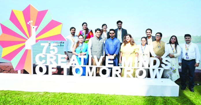 Union Minister for Information and Broadcasting, Youth Affairs and Sports, Anurag Singh Thakur in a group photograph at the inaugural ceremony of '75 Creative Minds of Tomorrow' at 54th International Film Festival of India (IFFI), in Panaji, Goa on Tuesday. (UNI)