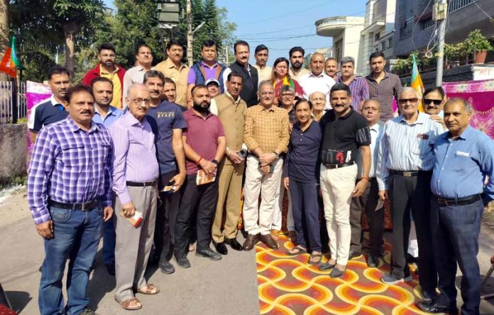 Senior BJP leader, Kavinder Gupta during booth Jan Samvad Abhiyan in Gandhi Nagar on Sunday.