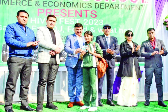 Students being honoured by chief guest Arun Gupta, President Chamber of Commerce and Industry, Jammu during Annual Hiver Fest-2023.