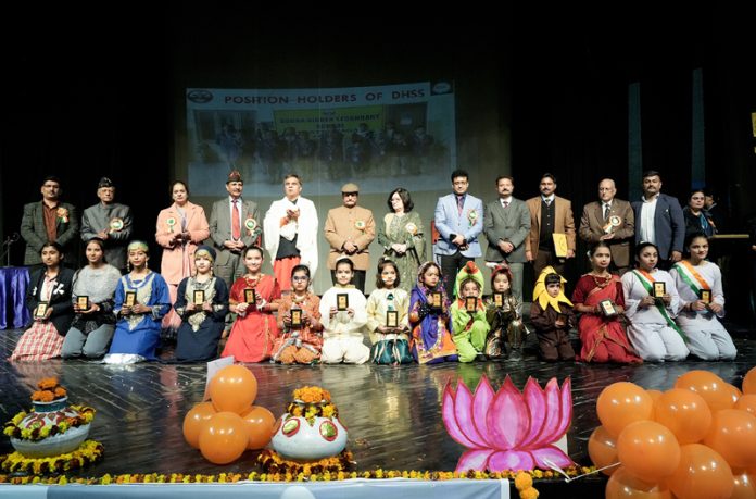 Students of Dogra Higher Secondary School posing with chief guest Ravinder Raina during Annual Day event.