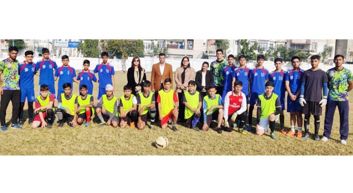 Zahid Naseem Manhas, Commandant SDRF 2nd Bn posing for group photograph with the football team during Inter-School Football Championship at Jammu. 